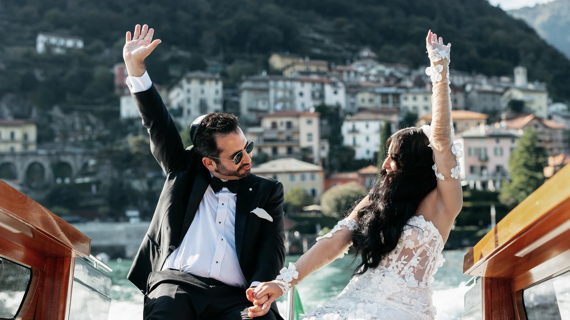 Just married couple celebrating with a photoshoot on a taxi boat on Lake Como